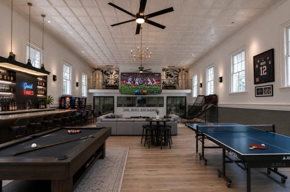 The original ballroom under its pressed-tin ceiling, with bar, billiards and table tennis